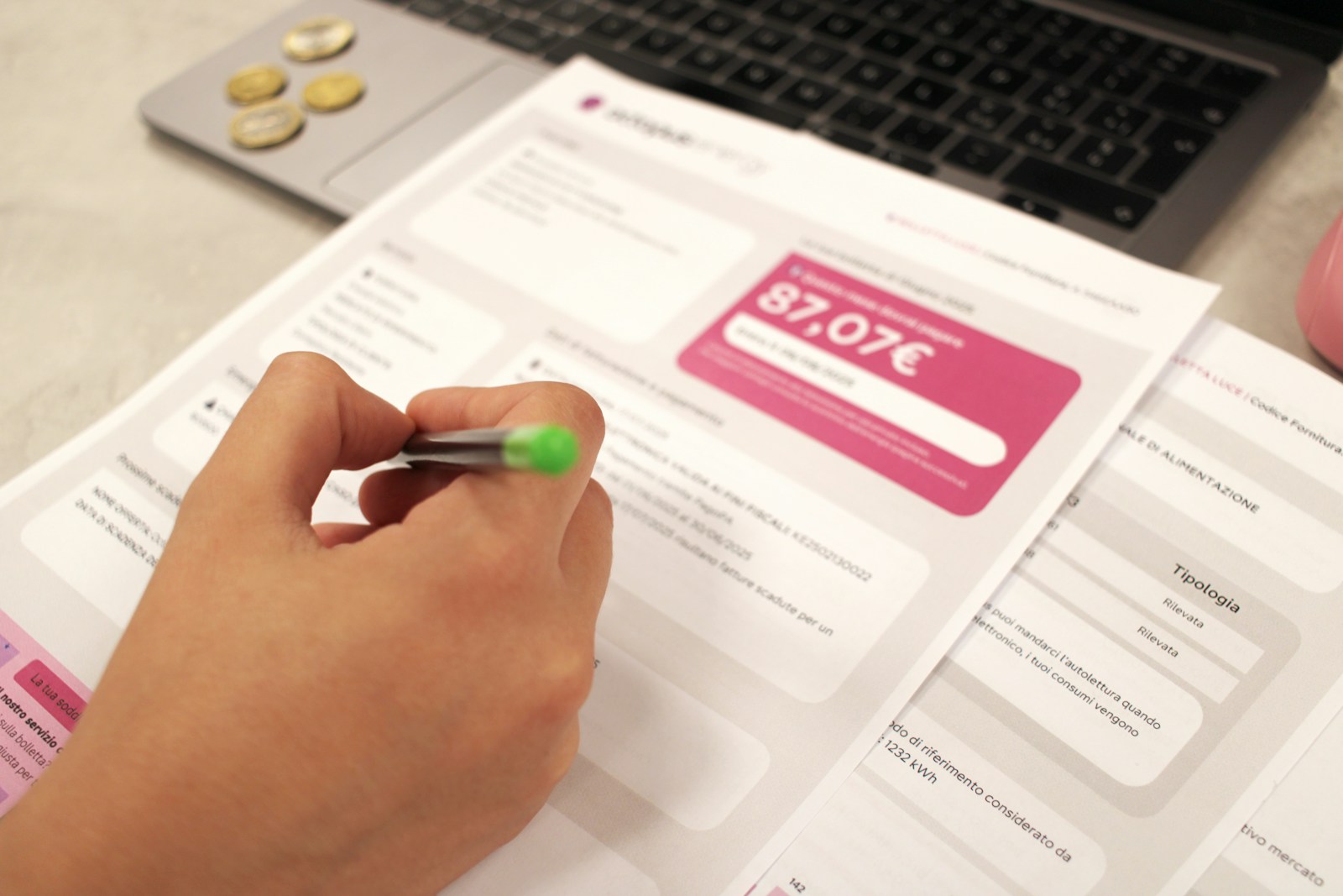 A utility bill and paperwork on a table
